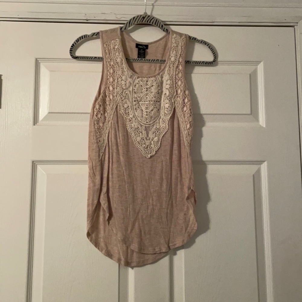 Tan tank top with white lace design.